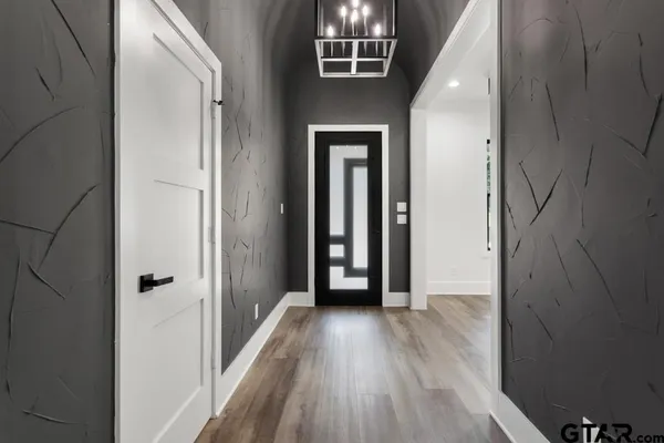 a bathroom with a granite countertop sink and vanity