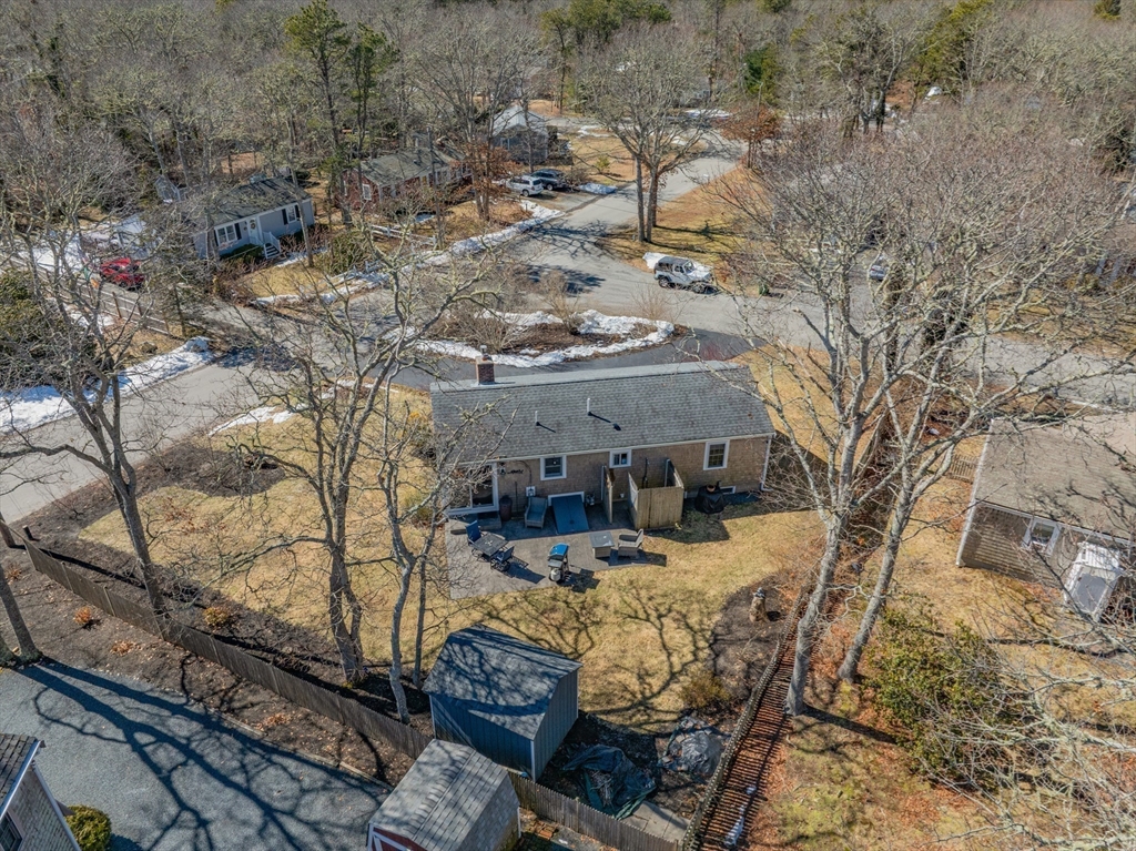 16 Hazelwood Road Dennis, MA 02660 - Photo 4 of 40 a view of a patio with chair and table