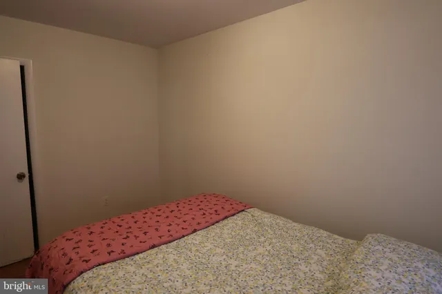 a bedroom with a bed in it
