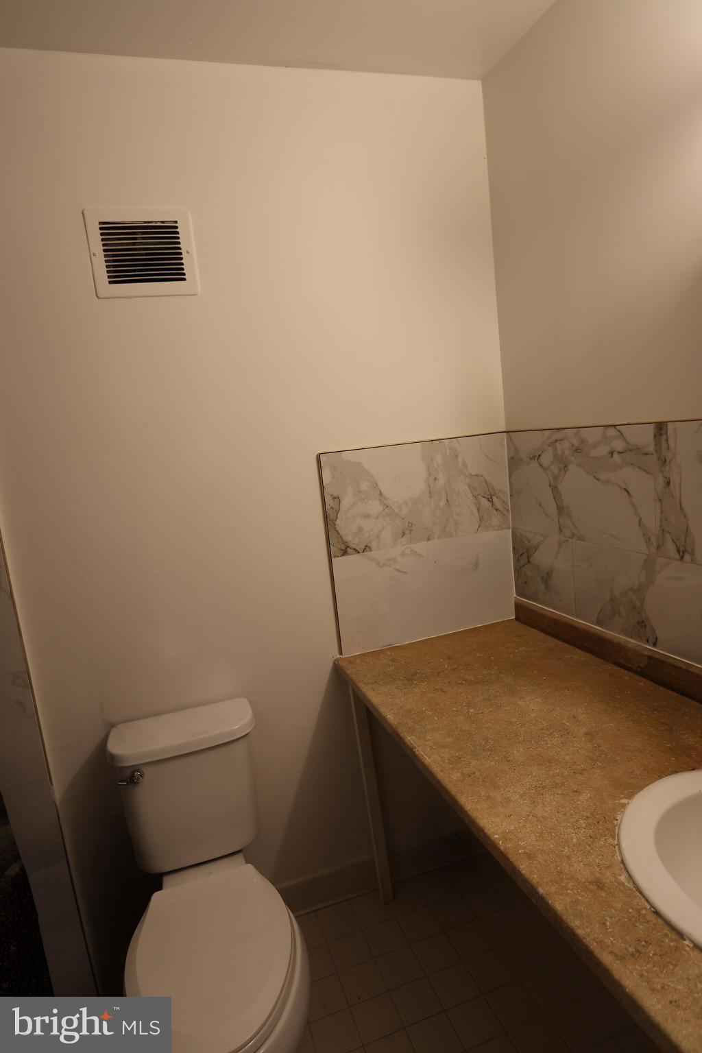 2906 Kings Chapel Road, Unit 6/4 Falls Church, VA 22042 - Photo 16 of 17 a bathroom with a granite countertop sink and a toilet