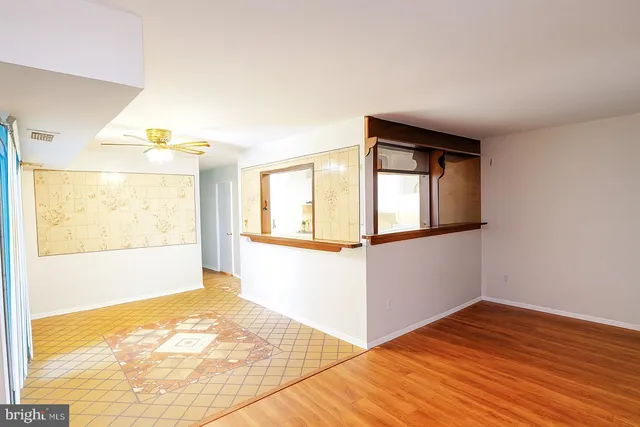 a view of an empty room and window