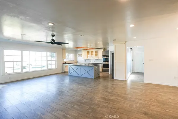 a view of kitchen with cabinets and wooden floor