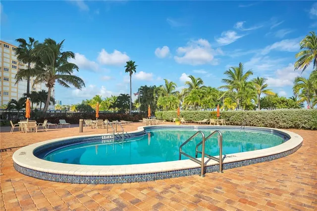 a view of a swimming pool with a patio