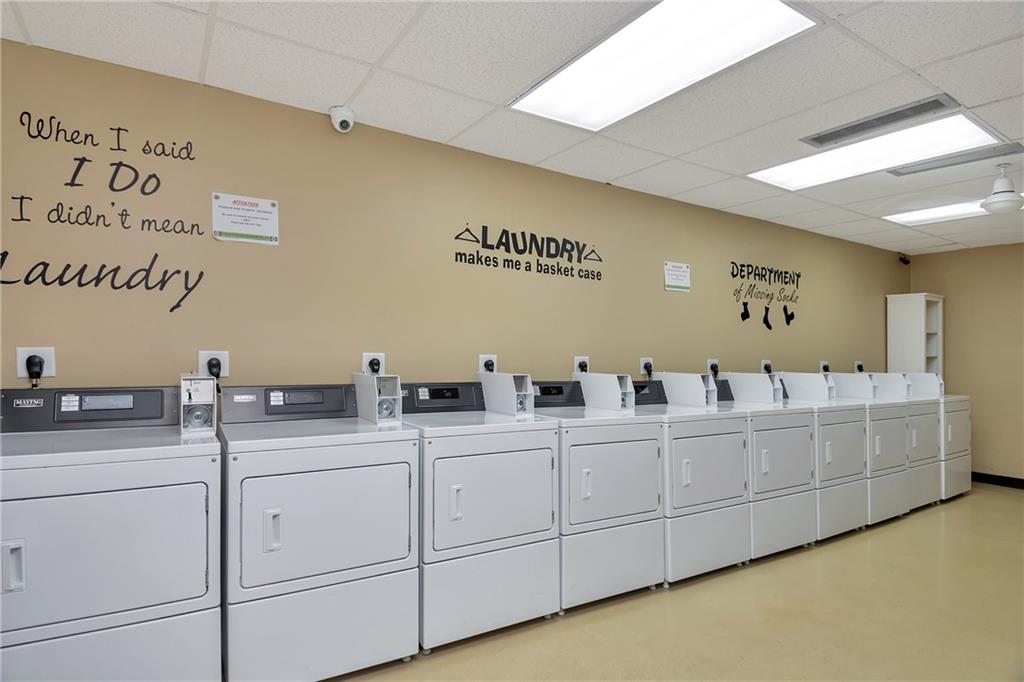 305 North Pompano Beach Boulevard, Unit 1006 Pompano Beach, FL 33062 - Photo 23 of 42 a kitchen with white cabinets and sink