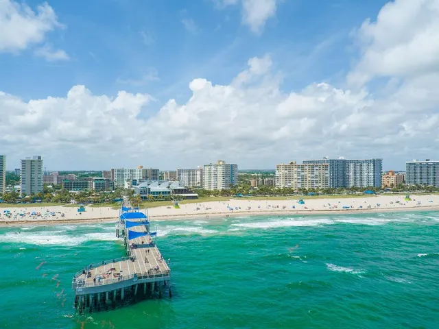 a view of a swimming pool and a yard