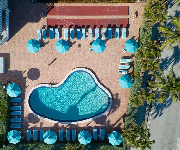 a view of a swimming pool in the backyard