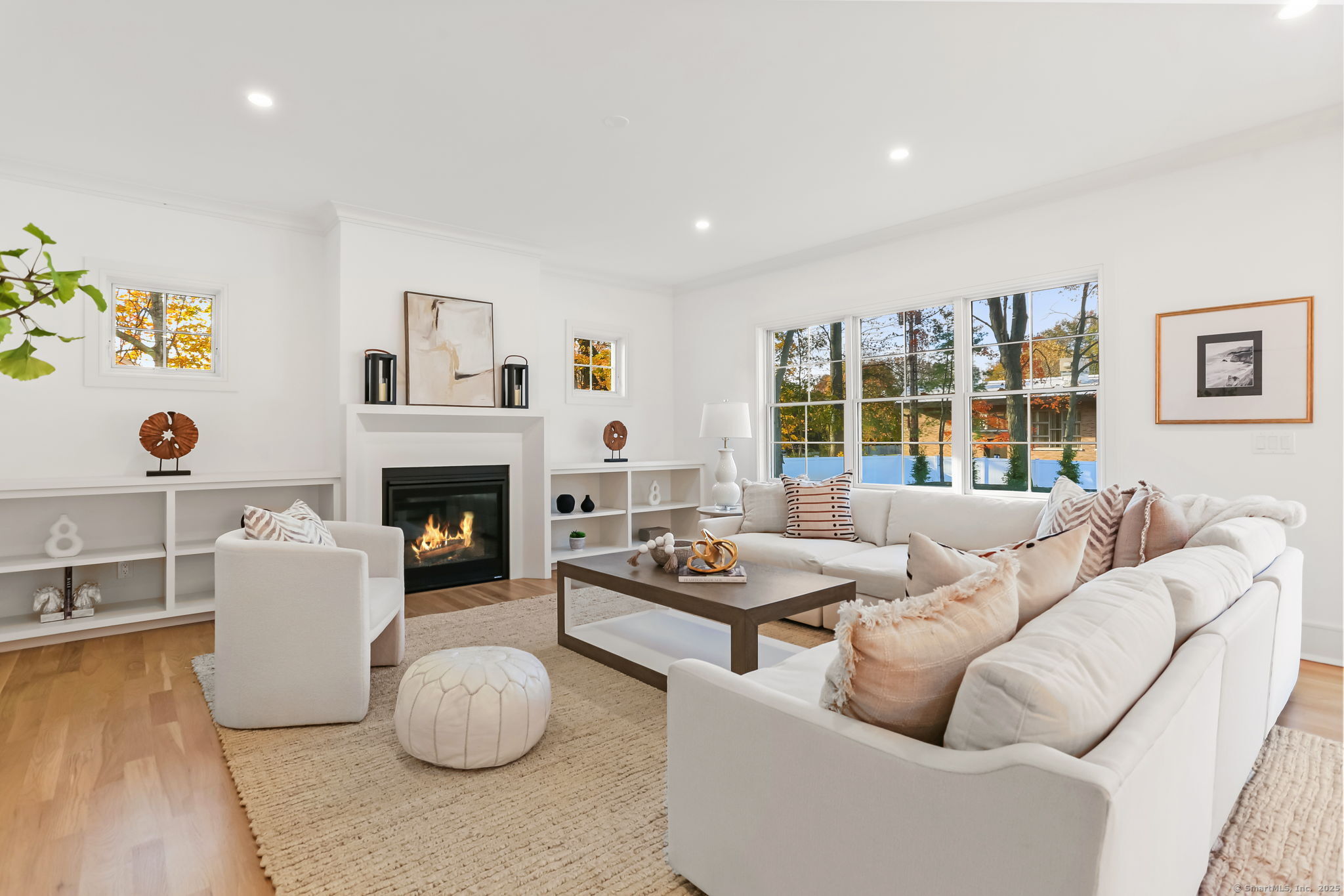 31 High Ridge Road Fairfield, CT 06825 - Photo 14 of 37 a living room with furniture and a fireplace
