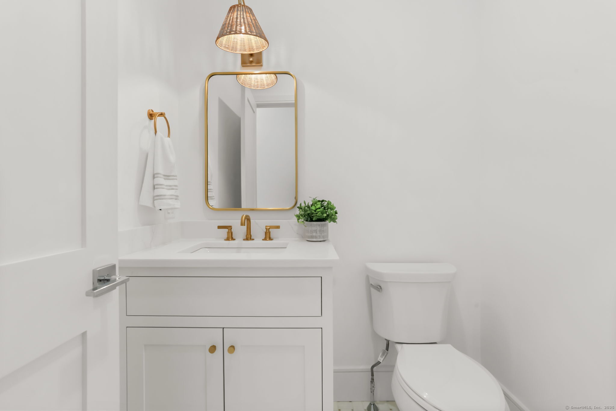 31 High Ridge Road Fairfield, CT 06825 - Photo 16 of 37 a bathroom with a toilet sink and mirror