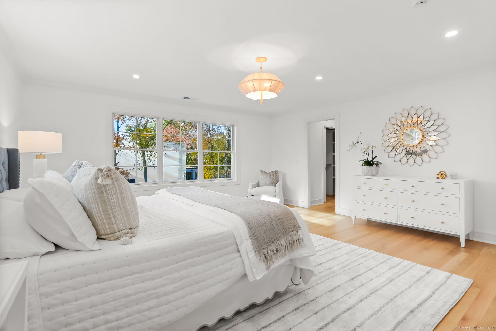 31 High Ridge Road Fairfield, CT 06825 - Photo 19 of 37 a spacious bedroom with a bed and a window