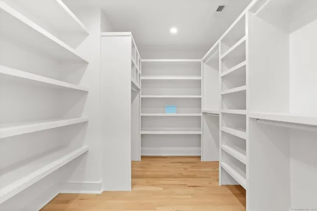 a white bath tub sitting next to a bathroom