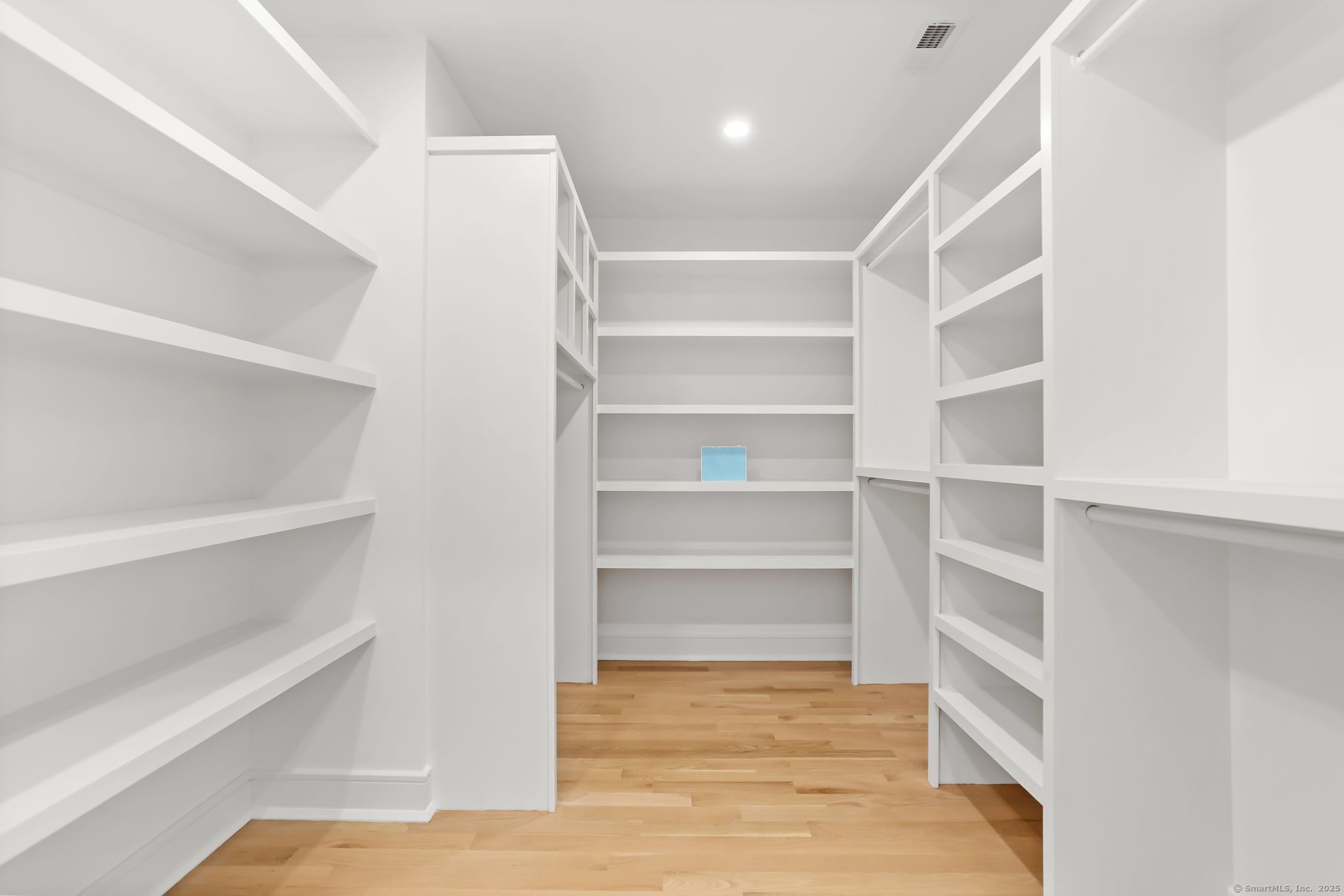 31 High Ridge Road Fairfield, CT 06825 - Photo 20 of 37 a view of walk in closet with empty racks