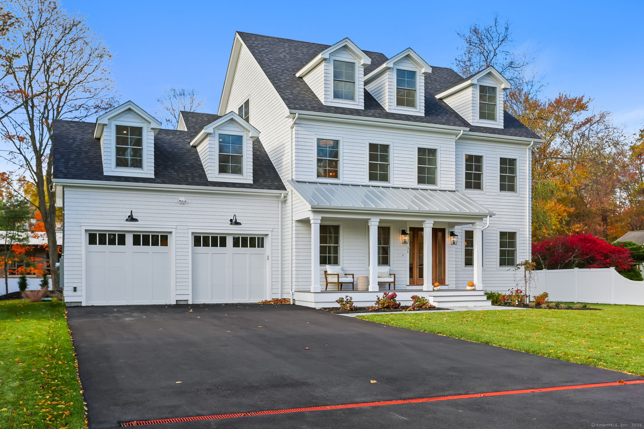 31 High Ridge Road Fairfield, CT 06825 - Photo 2 of 37 a front view of a house with a yard and garage