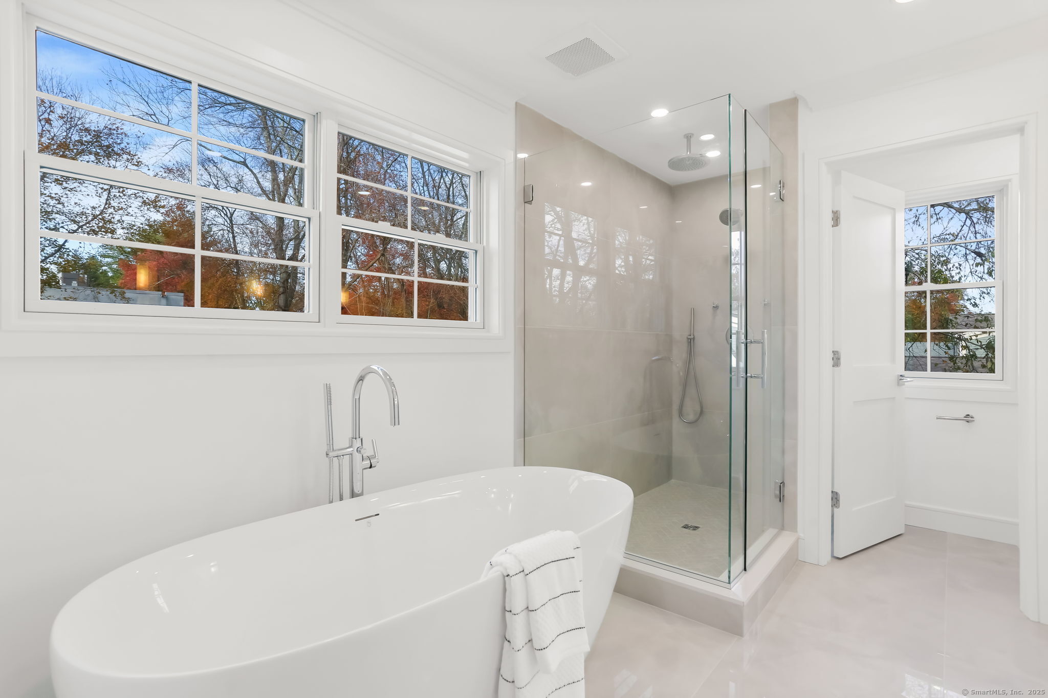 31 High Ridge Road Fairfield, CT 06825 - Photo 21 of 37 a white bath tub sitting next to a bathroom