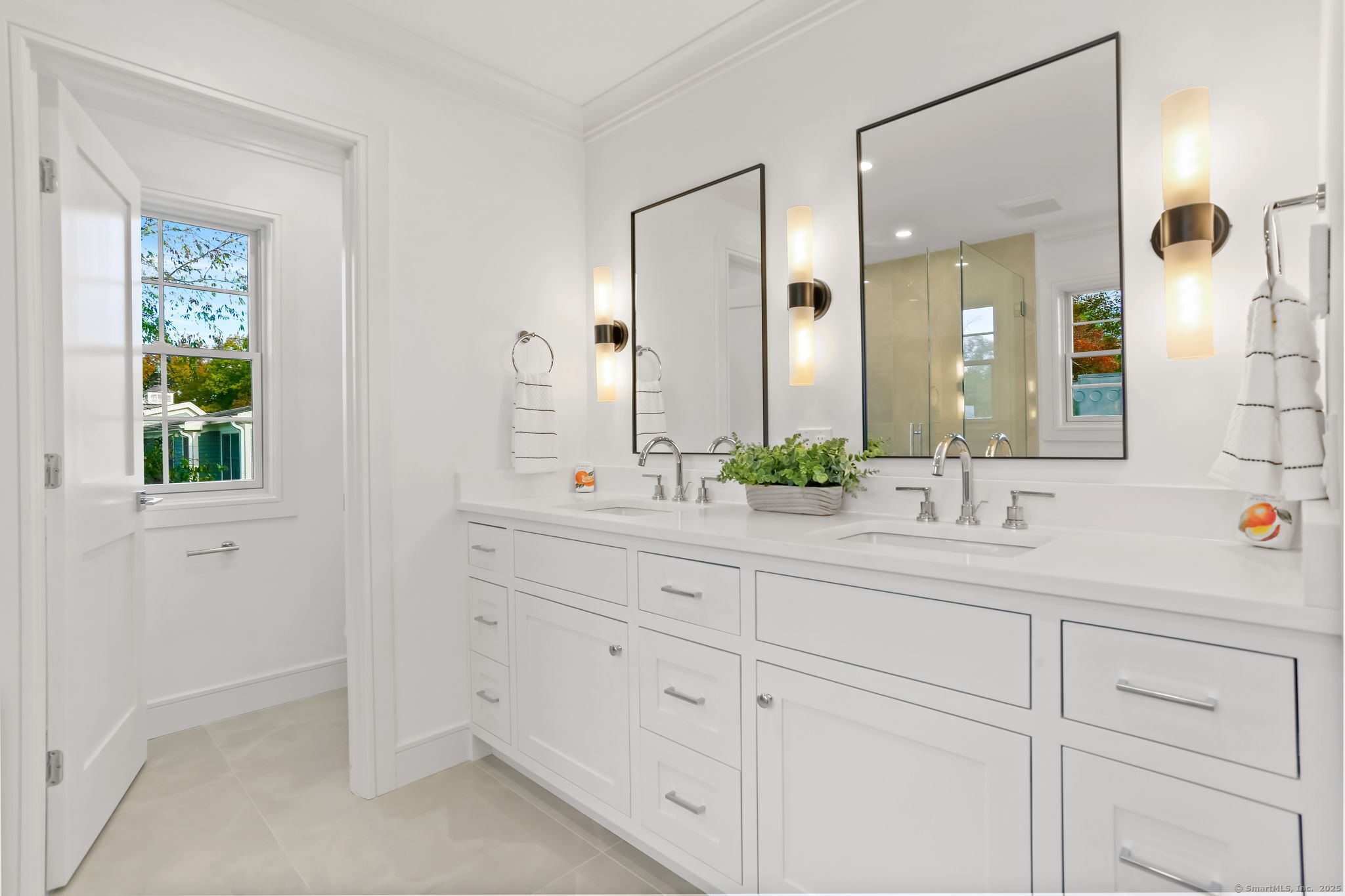 31 High Ridge Road Fairfield, CT 06825 - Photo 22 of 37 a bathroom with a sink and a mirror