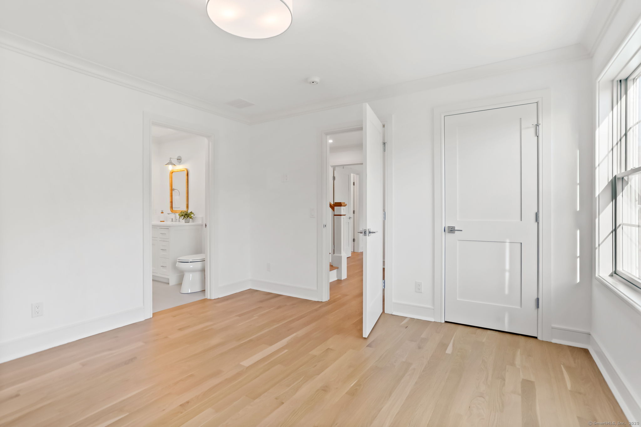 31 High Ridge Road Fairfield, CT 06825 - Photo 23 of 37 a view of empty room with wooden floor and window