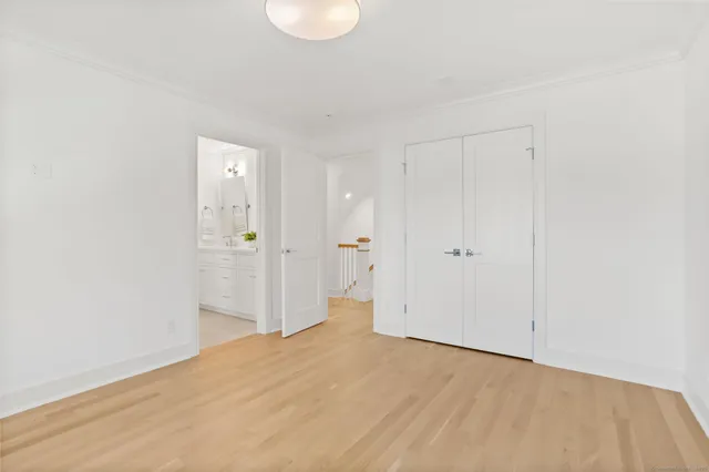 a bathroom with a granite countertop sink a potted plant and a window