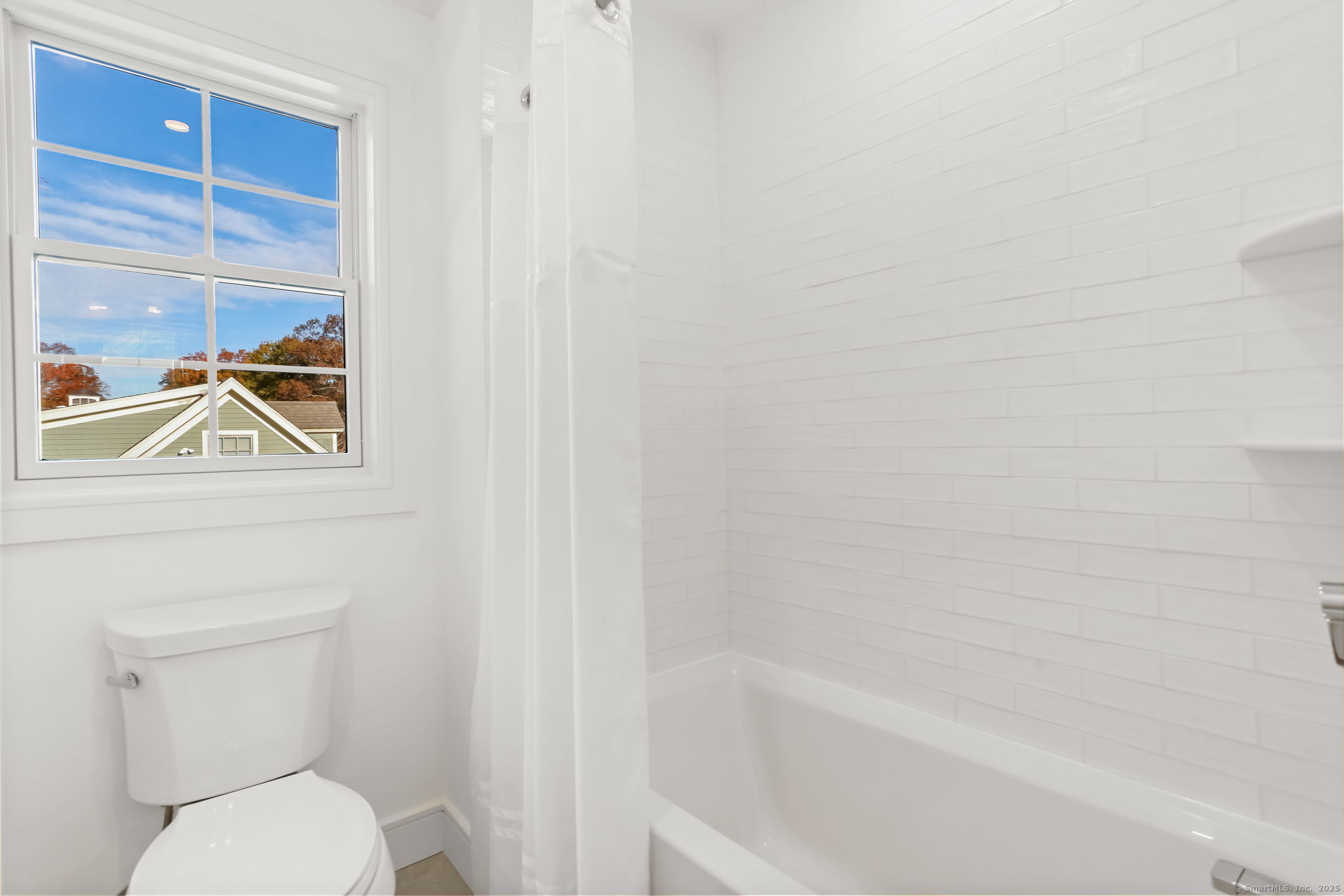 31 High Ridge Road Fairfield, CT 06825 - Photo 27 of 37 a bathroom with a toilet and a bathtub