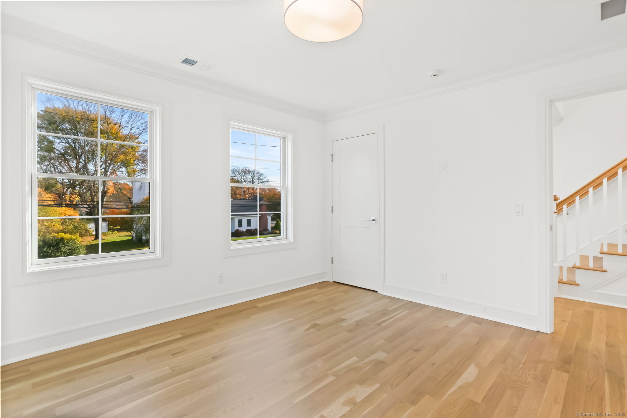 31 High Ridge Road Fairfield, CT 06825 - Photo 28 of 37 a view of empty room with wooden floor and fan