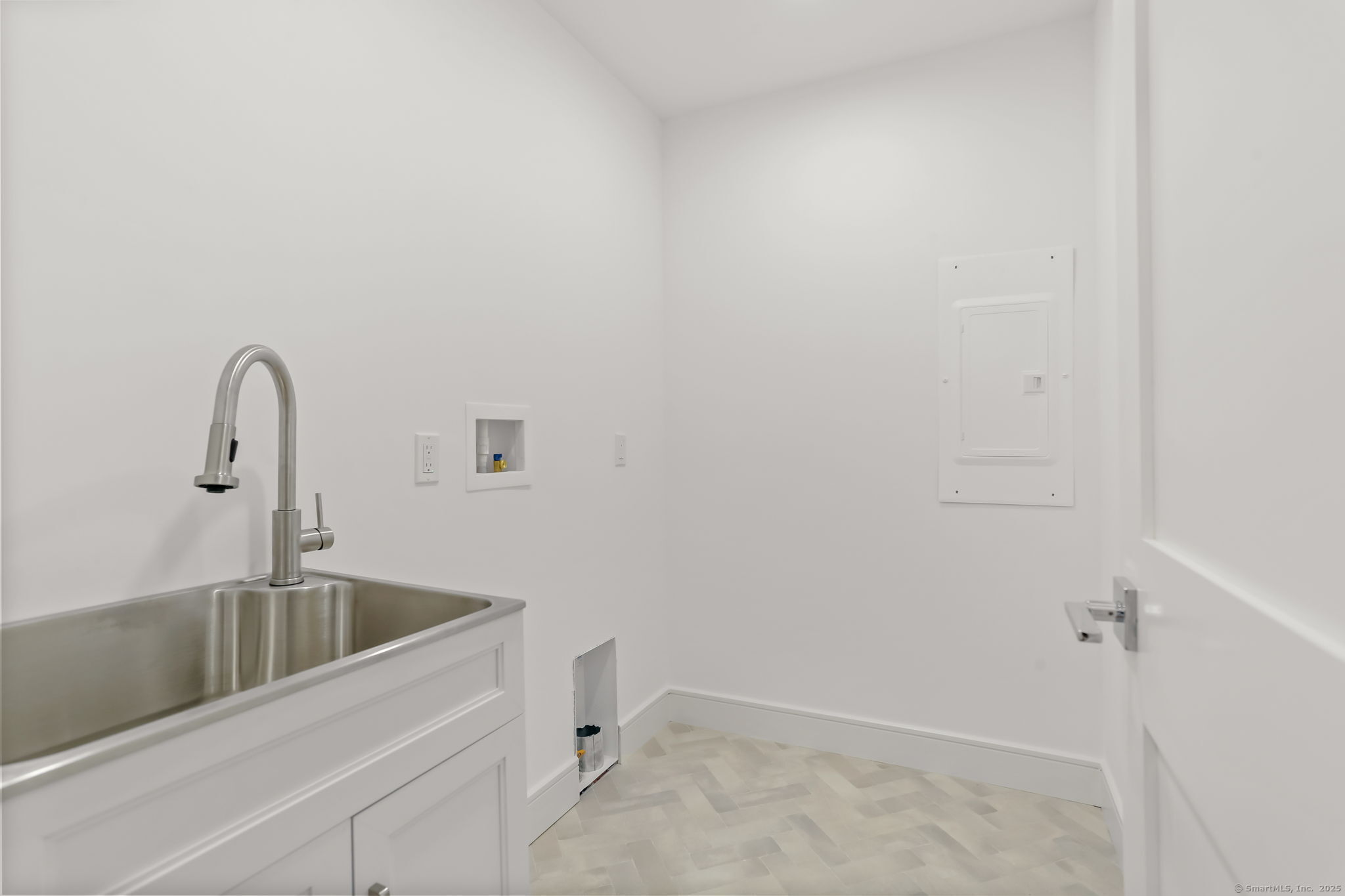 31 High Ridge Road Fairfield, CT 06825 - Photo 30 of 37 a close view of a sink and tap