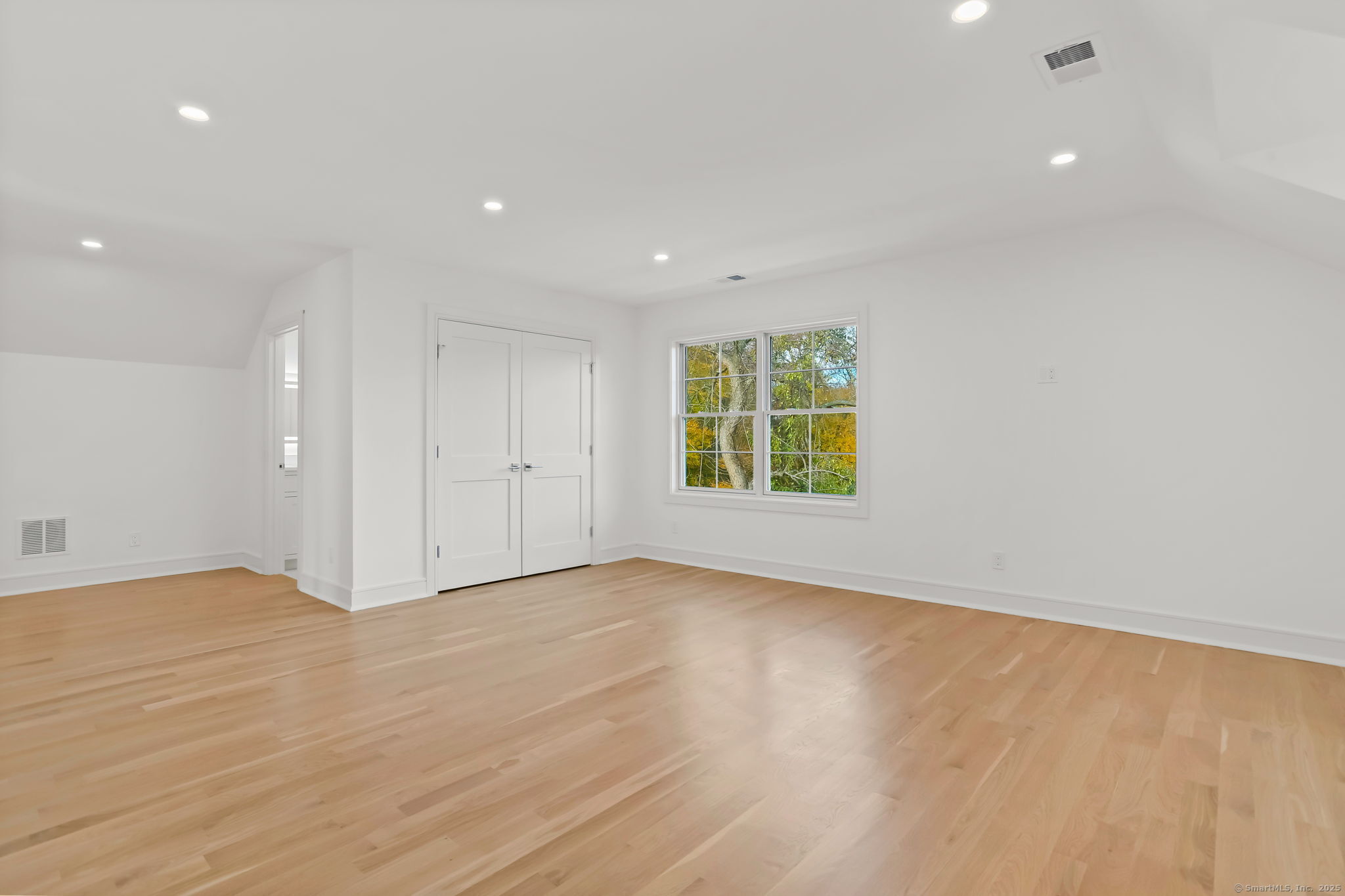 31 High Ridge Road Fairfield, CT 06825 - Photo 32 of 37 an empty room with wooden floor and windows