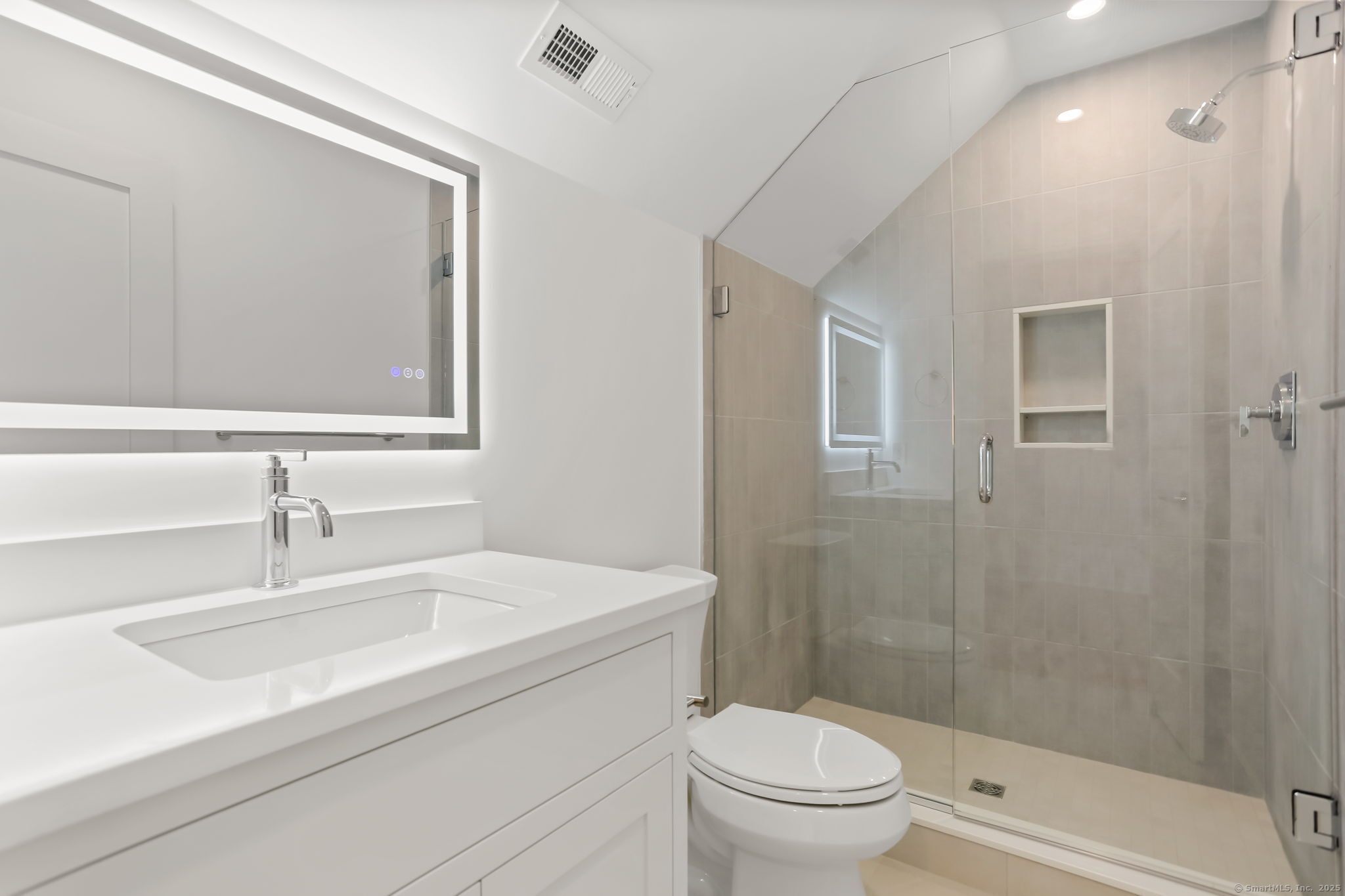 31 High Ridge Road Fairfield, CT 06825 - Photo 33 of 37 a bathroom with a sink a toilet and shower