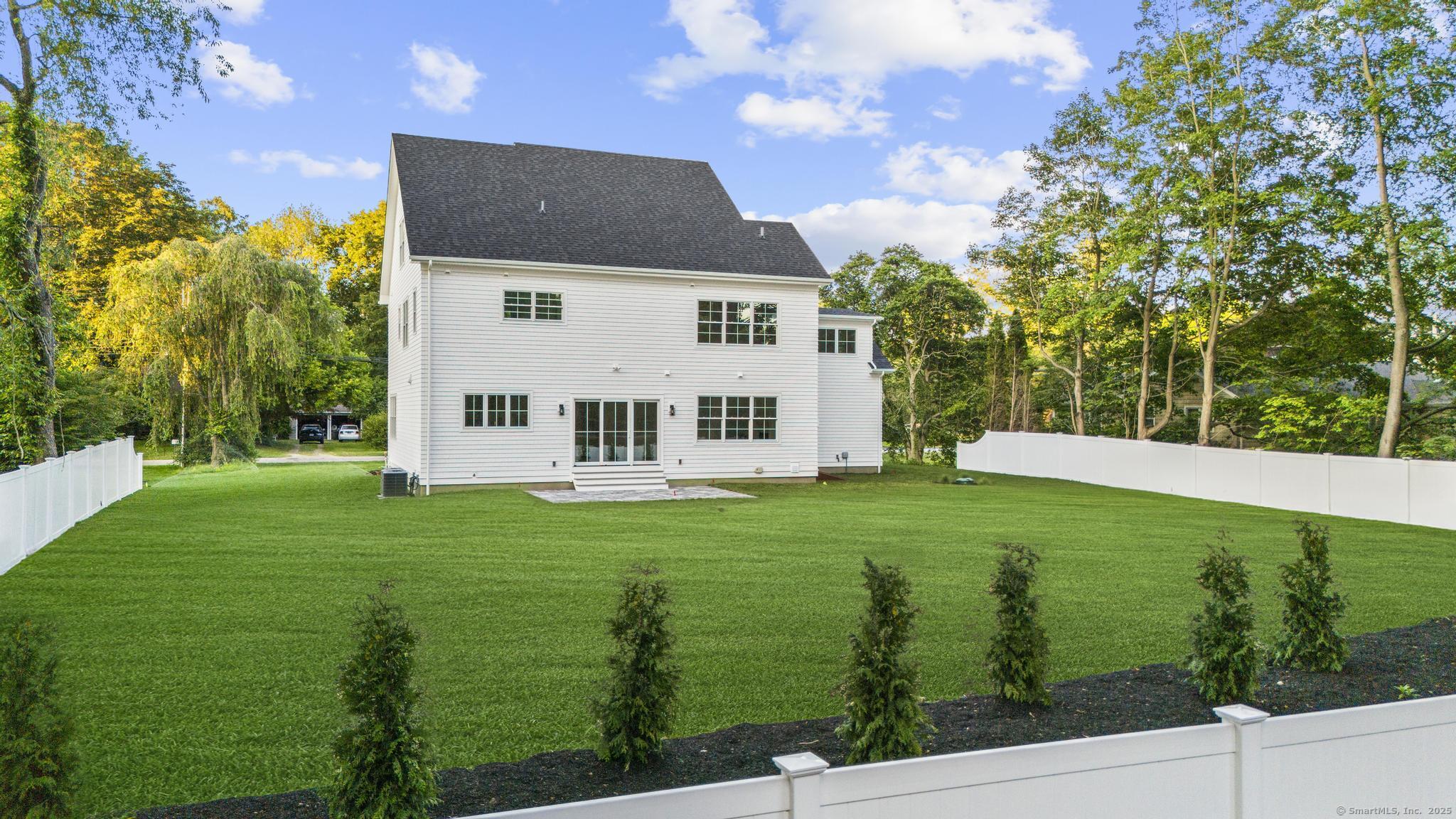 31 High Ridge Road Fairfield, CT 06825 - Photo 35 of 37 a view of a house with a yard