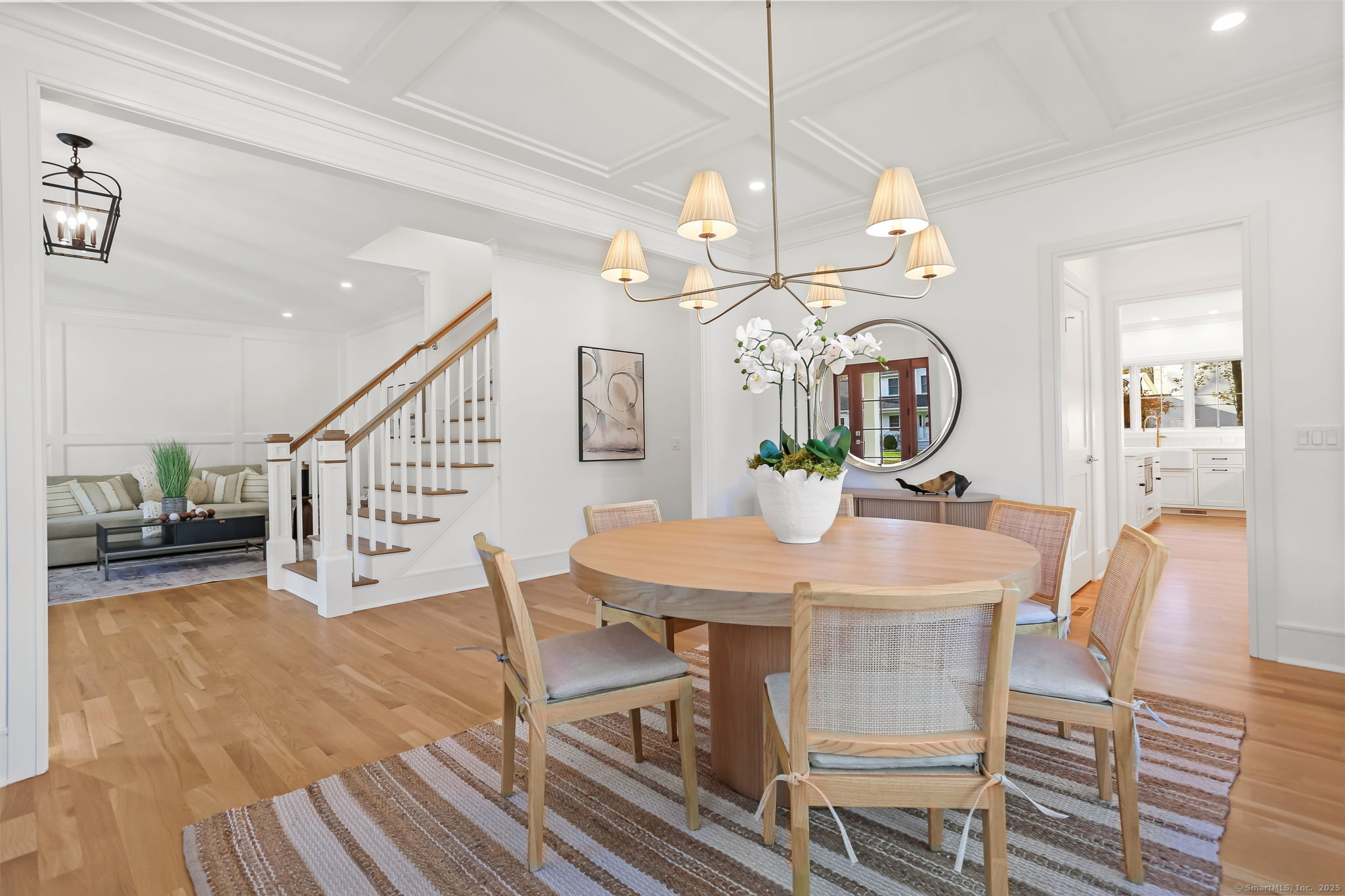 31 High Ridge Road Fairfield, CT 06825 - Photo 9 of 37 a view of a dining room with furniture and a chandelier