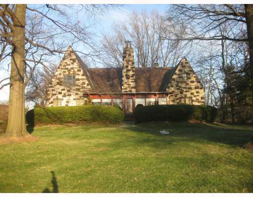 Exterior Front. TRULY ONE OF A KIND STONE TUDOR ENJOY SUNSETS!