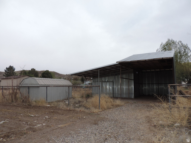 140 North 200 E Street Glenwood, UT 84730 - Photo 50 of 54 View of pole building featuring driveway and a carport
