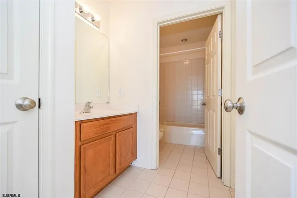 a bathroom with a shower and a sink