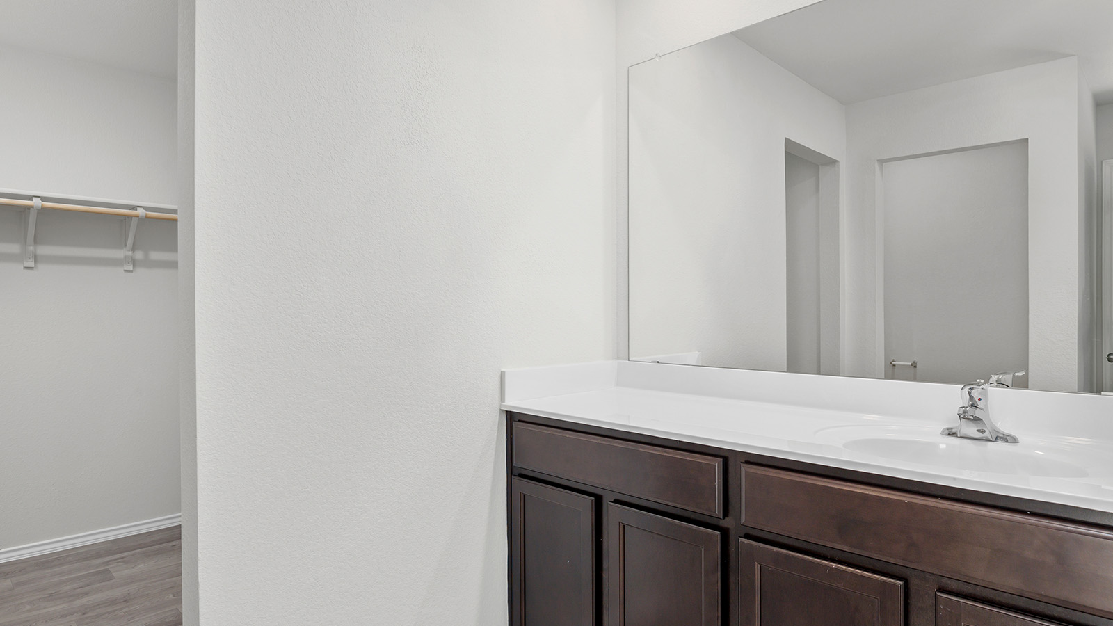 1407 Victory Rnch Trail Killeen, TX 76549 - Photo 14 of 24 Ample counter space with an integrated sink and mirror, conveniently adjacent to a well-appointed closet.