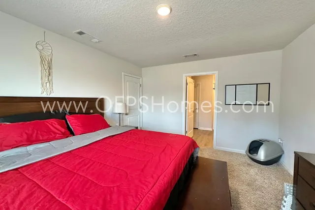 a bedroom with a bed and glass area