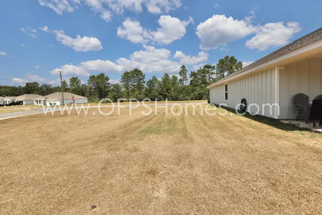 a view of an outdoor space and basketball court