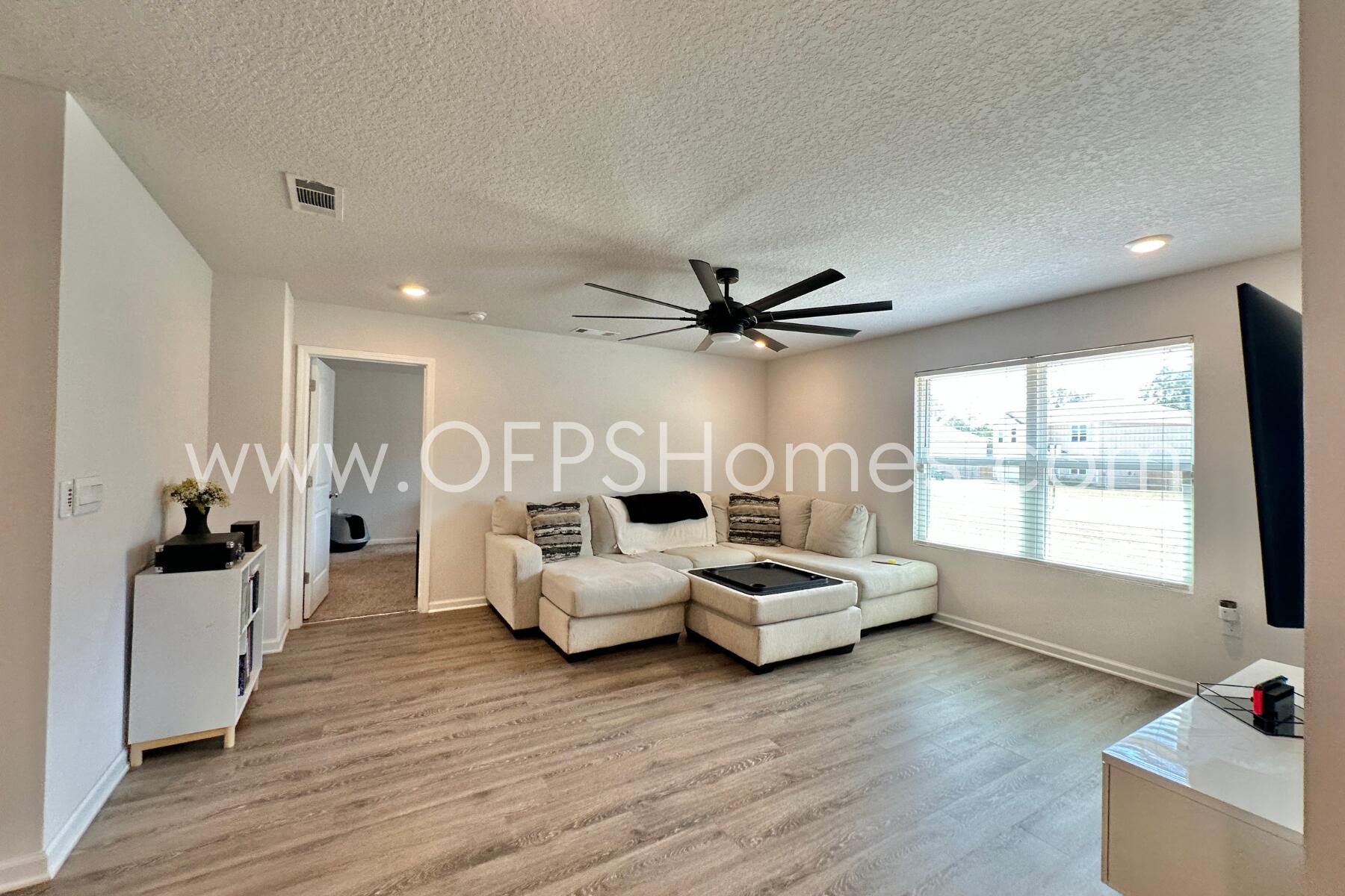 3582 Sugar Maple Lane Crestview, FL 32539 - Photo 20 of 33 a living room with furniture and a large window