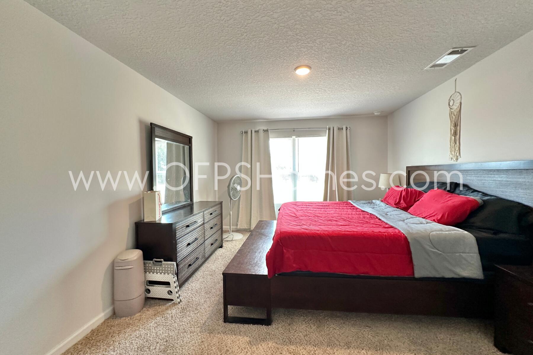 3582 Sugar Maple Lane Crestview, FL 32539 - Photo 25 of 33 a bedroom with a bed and a couch