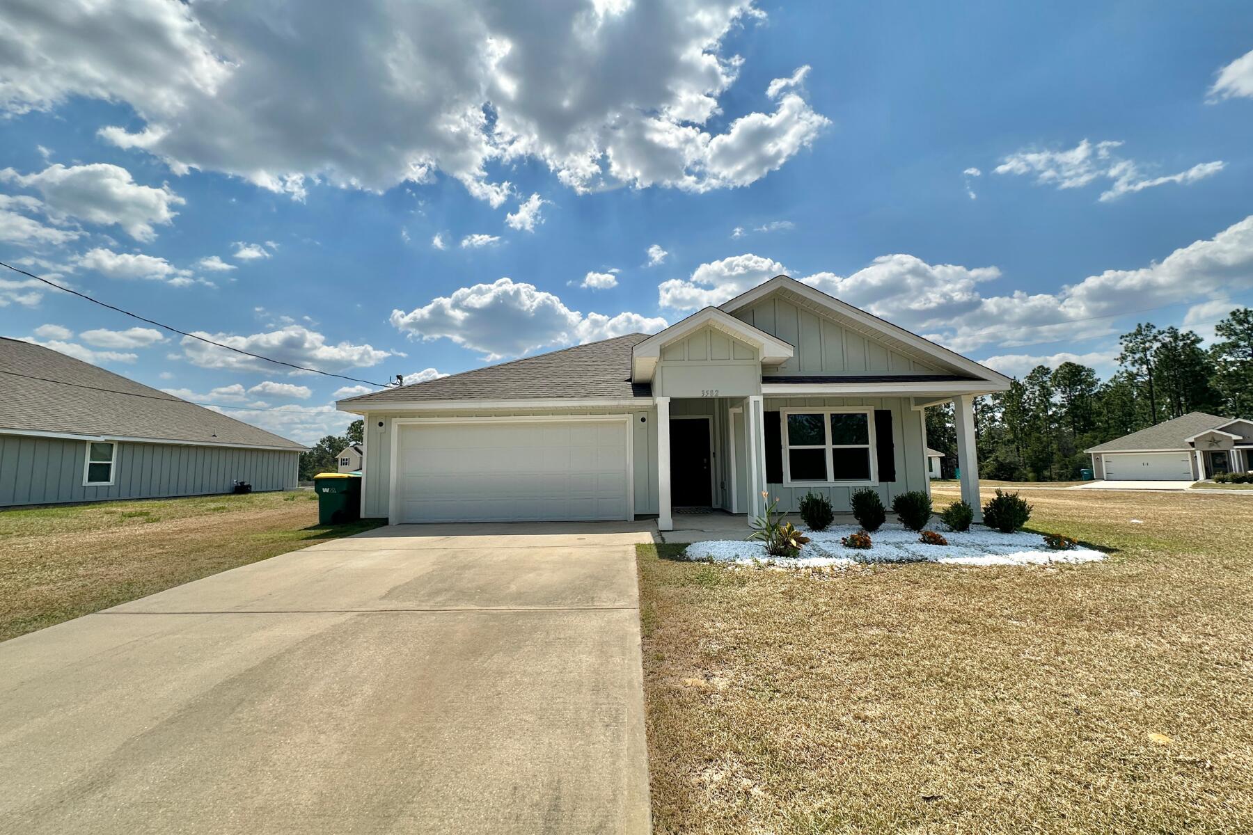 3582 Sugar Maple Lane Crestview, FL 32539 - Photo 3 of 33 a front view of house with yard and trees in the background