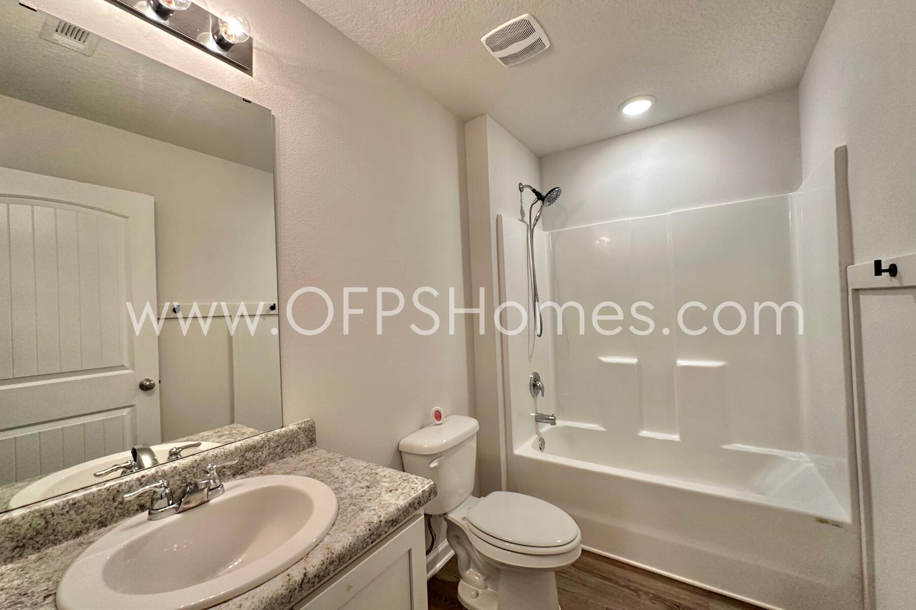 3582 Sugar Maple Lane Crestview, FL 32539 - Photo 7 of 33 a bathroom with a sink a toilet and shower