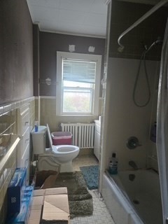 17 Spencer Street Springfield, MA 01118 - Photo 6 of 14 a bathroom with a bathtub and a shower