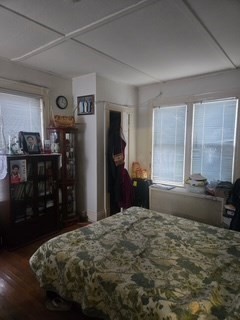 17 Spencer Street Springfield, MA 01118 - Photo 7 of 14 a bedroom with a bed and a dresser