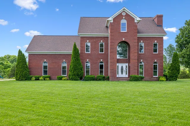 front view of a house with a yard