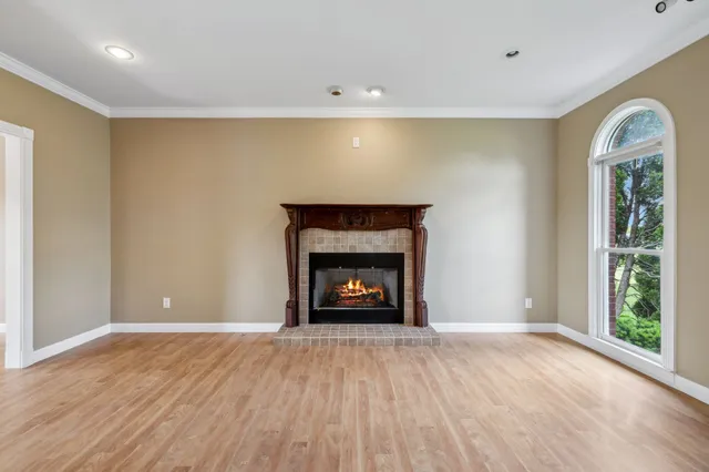 a kitchen with stainless steel appliances granite countertop a sink a stove and cabinets