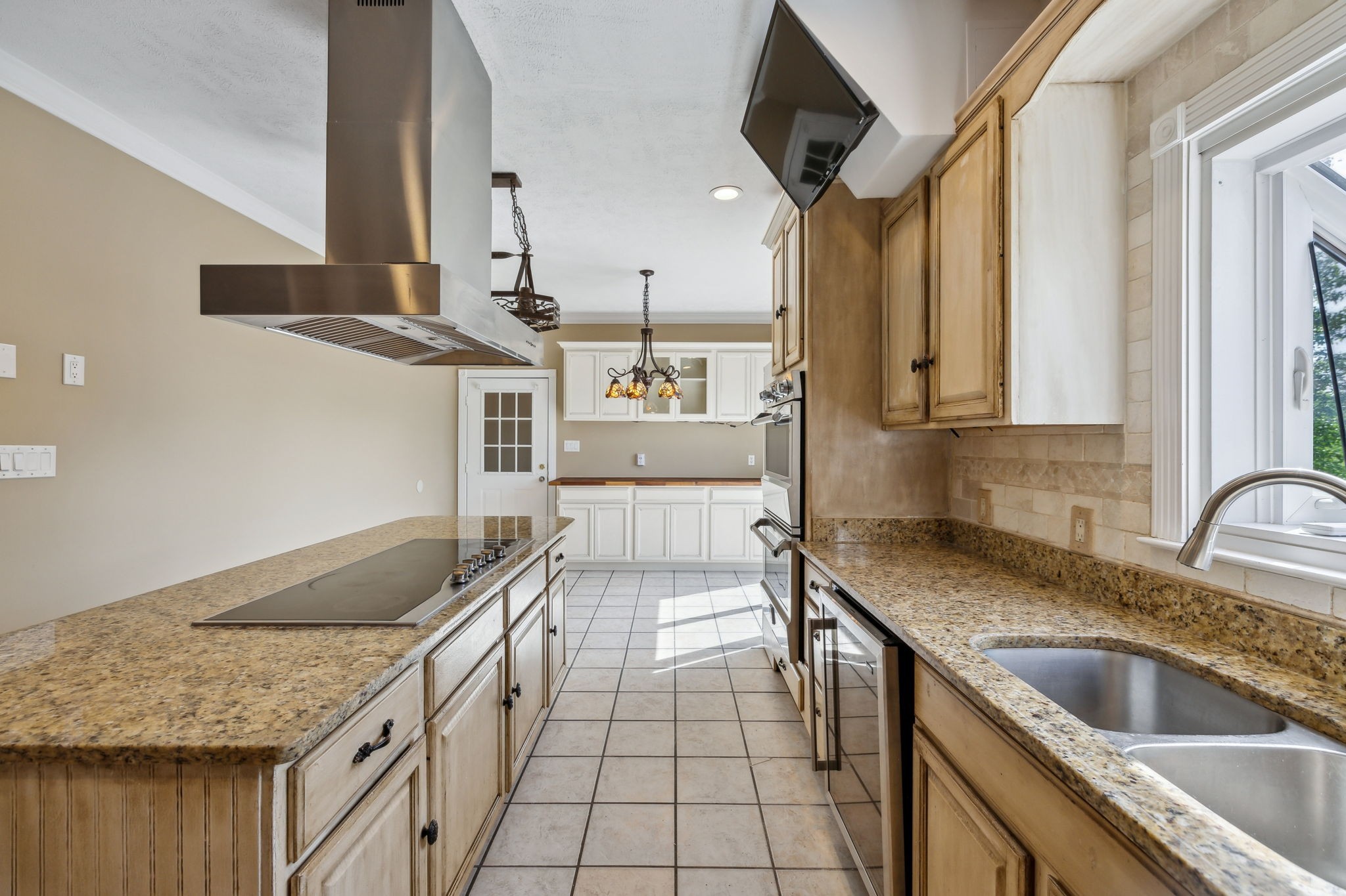 122 Windcrest Drive Hohenwald, TN 38462 - Photo 24 of 94 a kitchen with a sink stove and cabinets