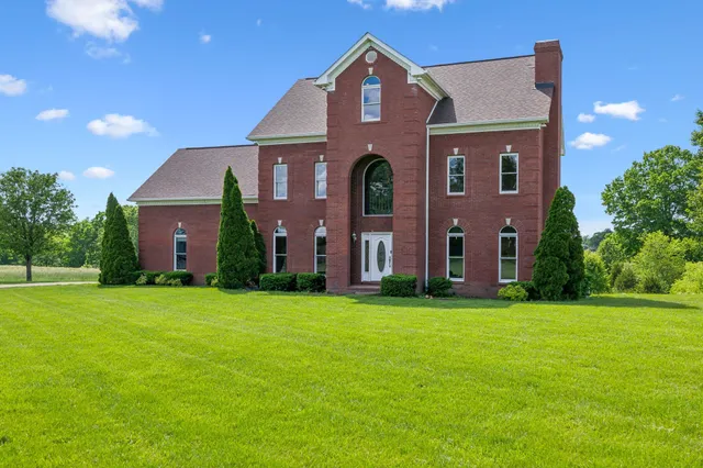 a view of a livingroom with an empty space and a fireplace