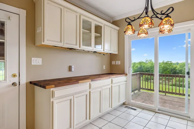 a bathroom with a tub sink and a mirror