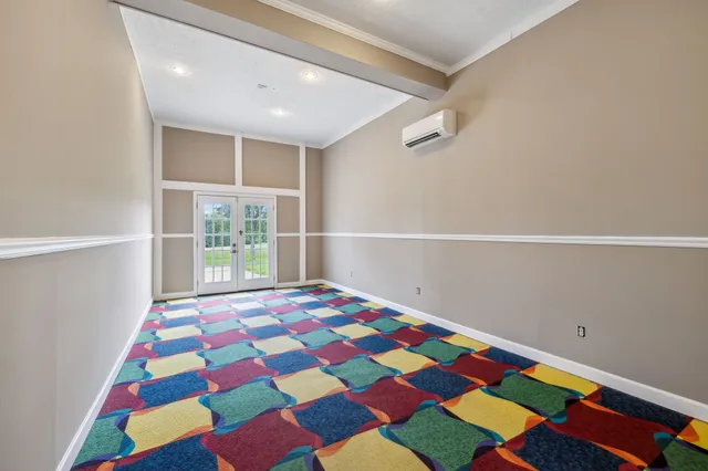 a view of an empty room with a window