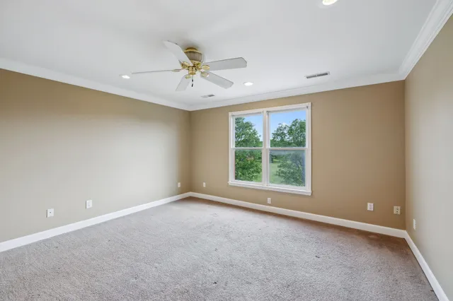 a brick building with a yard in front of it