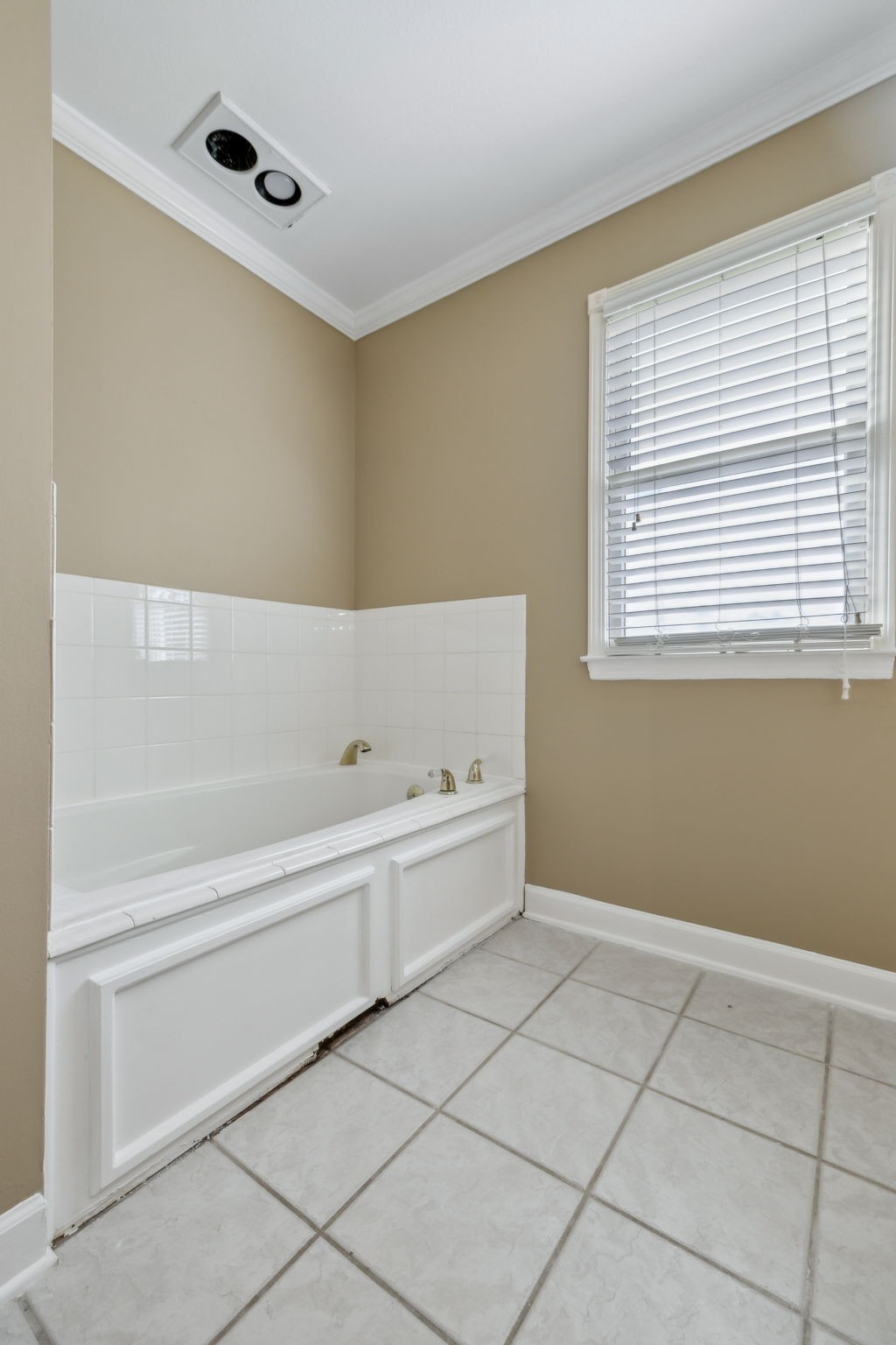 122 Windcrest Drive Hohenwald, TN 38462 - Photo 55 of 94 a bathroom with a bathtub and a window