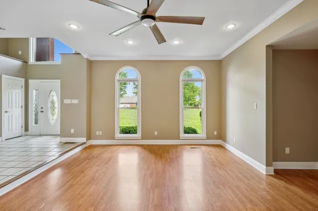 a view of entryway and hall with a front door