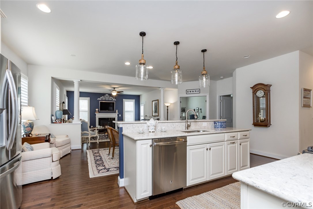1372 Miners Trail Road Midlothian, VA 23114 - Photo 12 of 50 a large kitchen with kitchen island a sink a stove a dining table and chairs