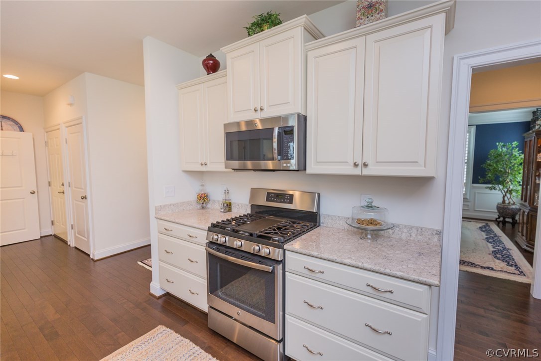 1372 Miners Trail Road Midlothian, VA 23114 - Photo 13 of 50 a kitchen with granite countertop white cabinets and stainless steel appliances